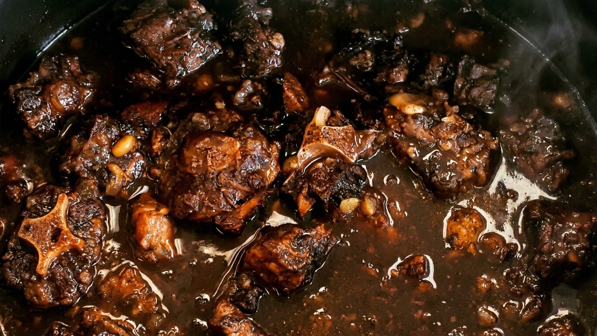Oxtail, curry goat, brown stew chicken